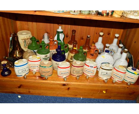 A QUANTITY OF SPIRIT FLASKS etc, to include Wade, 'Sherry', 'Cognac', 'Scotch', 'Bells Whisky', 'Whyte &amp; Mackay', a 'Crie