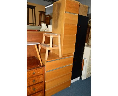 A LIGHT OAK CHEST OF FOUR LONG DRAWERS together with a matching tall narrow oak chest of five drawers, a tall modern two door