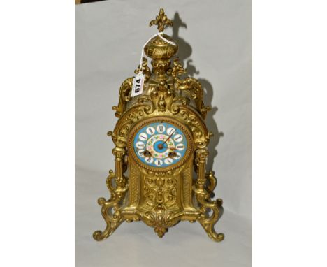 A BRASS FRENCH STYLE MANTEL CLOCK, printed enamel Roman numeral dial, on four scrolled feet, height 39cm (pendulum only)