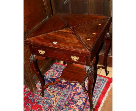 AN EDWARDIAN MAHOGANY ENVELOPE CARD TABLE with single drawer on cabriole legs united by a stretcher, 56cm squared x 71cm (s.d