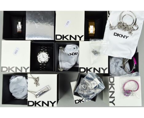 A BOX OF DKNY BOXED WATCHES AND JEWELLERY to include a gentleman's stainless steel wrist watchs, a pink enamel bangle, two ne