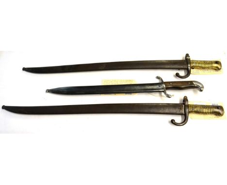 Two French Model 1866 Chassepot Yataghan sword bayonets, with scabbards, and an Argentine Model 1909 Bolo Sidearm, with scabb