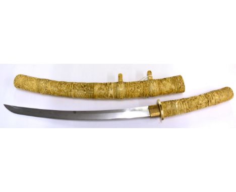 A Shinto Japanese Marine Ivory Wakizashi, circa 1700, with 36cm blade, one piece brass habaki, the sectional marine ivory hil