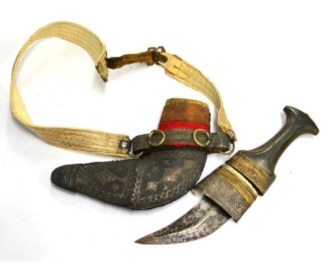 An Arab Jambiya, the 14cm curved blade with raised medial ridge, waisted horn grip, the wood scabbard with silver wire decora