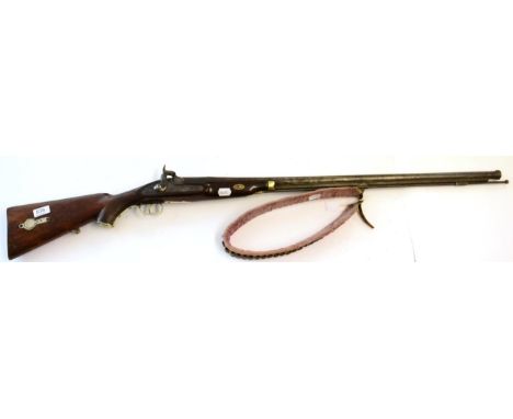 A 19th Century Indian Percussion Musket, the 88.5 cm steel barrel with flared muzzle decorated with a stiff leaf band, the lo