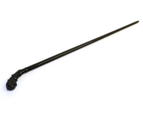 An Early 20th Century Ebony Swordstick, with 51 cm double edge blade, brass collar, fluted, bulbous handle carved in relief w