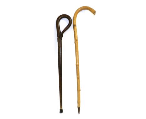 Two First World War Period German Walking Sticks, one carved with an iron cross and oak leaves and inscribed, ''Feldzug 1914-
