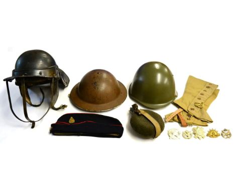 A Collection of Militaria, comprising a Second World War Brodie helmet, painted brown, indistinctly stamped and dated (?1938)