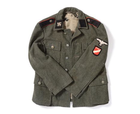 A Latvian Waffen-SS Man's Model 1943 Tunic, in field grey wool, with Latvian swastika collar patch on right side, and plain b