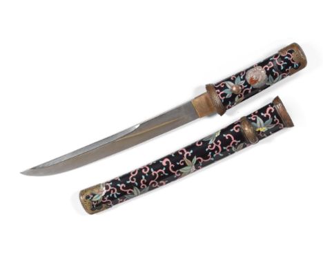 A 19th Century Japanese Cloisonne Enamel Aikuchi, the 22cm blade with narrow undulating hamon, one piece burred brass habaki,