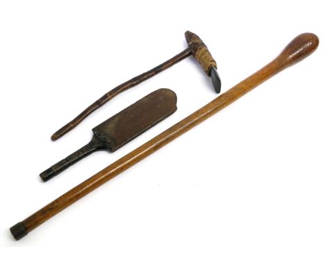 A South Sea Islands Pole Club, of honey colour, with root ball ovoid head and tapering cylindrical haft with iron ferrule, 90