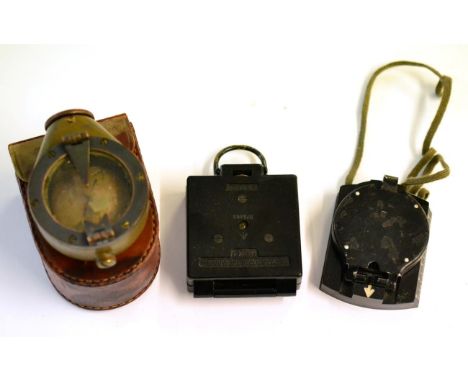 Three Various Military Compasses, comprising a U.S.E.D. Creagh-Osborne Marching Compass Mark VII, pigskin case; a T.G. Co. Lt