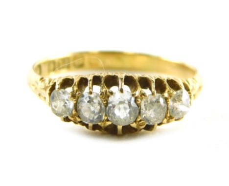 An 18ct gold diamond gypsy ring, set with five old cut diamonds, each in claw setting with scroll design shoulders, ring size