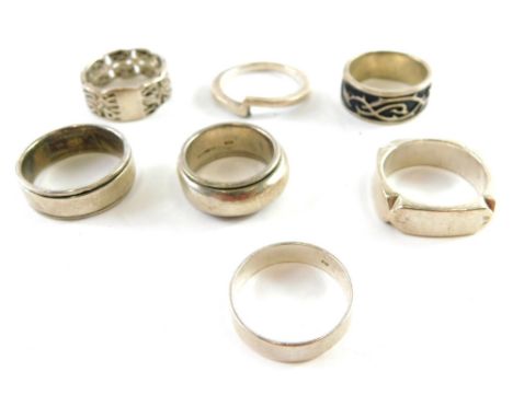 Seven silver and other dress rings, comprising woven design, enamel set wedding bands, etc., all stamped 925, 54.4g all in.