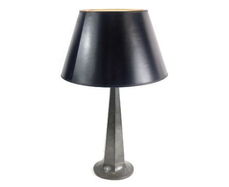 An early 20thC Homeland pewter table lamp, with later shade, the tapering hammered body numbered 513 to the underside, 53cm h