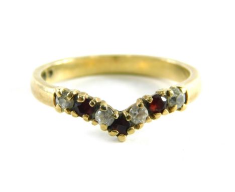 A 9ct gold wishbone ring, set with garnets and CZ, each in claw setting, ring size O½, 2.3g all in.