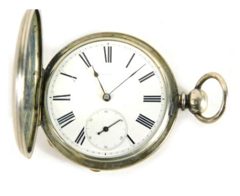 An early 20thC hunter pocket watch, marked Fine Silver, in engine turned case with vacant cartouche, with 6cm Roman numeric d