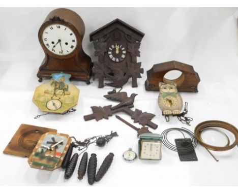 Various clocks, part clocks, clock workings, etc., a Black Forest style cuckoo clock, carved with birds and leaves, 32cm high