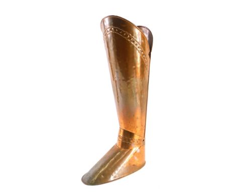 A 20thC studded copper boot stick stand, 52cm high.