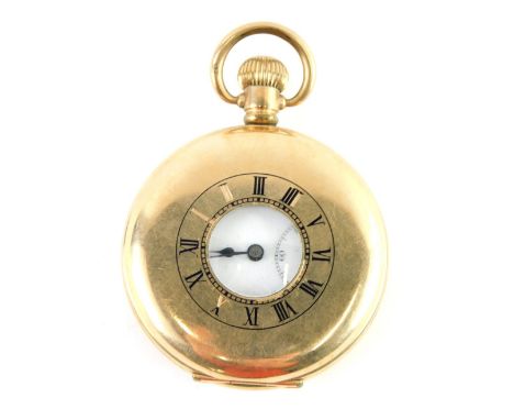 A Star Dennison gold plated half hunter pocket watch, the outer case with black enamel Roman numerals, white ceramic dial wit