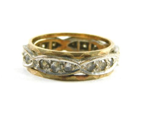 A diamond eternity ring, set with six marquee shaped panels, each set with three tiny diamonds, in a white metal setting with