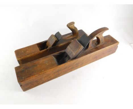 Two beech woodworking jack planes, one stamped R McIntyre, one stamped to the blade Marples, the other indistinct, 66cm long 