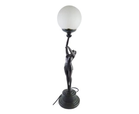 An Art Deco style table lamp, formed as a figure of a nude lady, with arm outstretched holding a crackle glass orb, on an inv