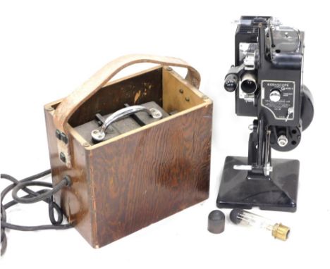 A vintage Kodascope model G series II projector, in fitted case, 43cm high, with accessories.
