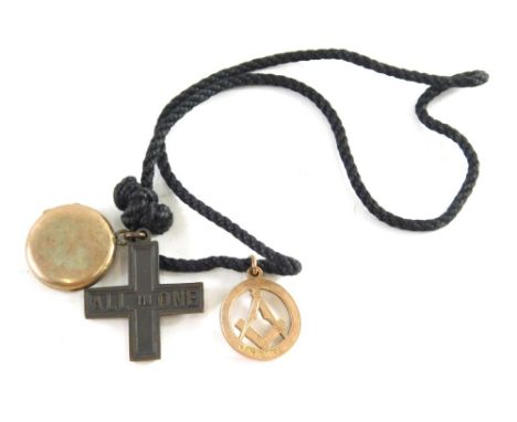 A 9ct gold Masonic fob, set with compass and set square, 3g, gold plated locket and a cross, attached to a cord chain.  