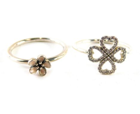 Two Pandora dress rings, comprising one with pink enamel flower, ring size S and a white stone set four leaf clover, rings si