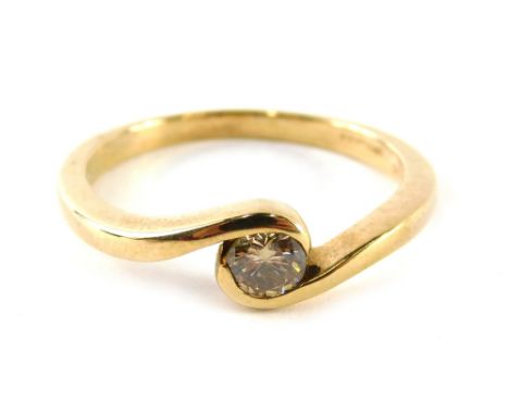 A 9ct gold diamond solitaire dress ring, in central twist design setting, approximately 0.40 carats, yellow metal, ring size 