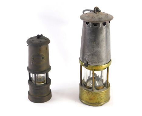 A 20thC brass miner's lamp, of cylindrical form with metal fittings, 25cm high, and a further smaller Lamp And Limelight Coll