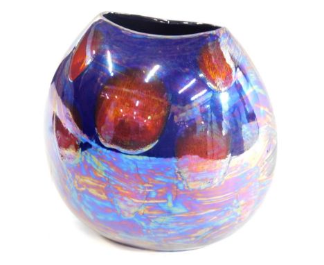 A large Poole pottery vase, with TT initialled to the base, in opalescent purple and silvered colours, 27cm high. 