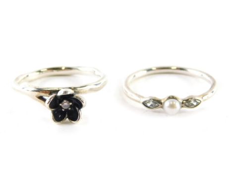 Two Pandora dress rings, one set with pearl and marcasite shaped clear stones, ring size S and another with blackened flower 