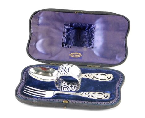 A late Victorian silver Christening set, by Josiah Williams and Co, comprising spoons, fork, and napkin ring, with Sorley ret