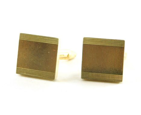 A pair of 9ct gold square set cuff links, each with engine turned decoration, 9.8g all in.