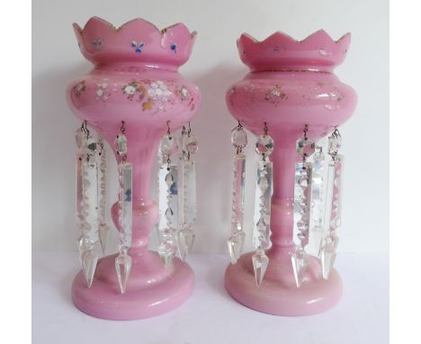 A pair of 19th century pink glass table lustres (30 cm high)Condition Report: The items are dusty and dirty and in need of a 