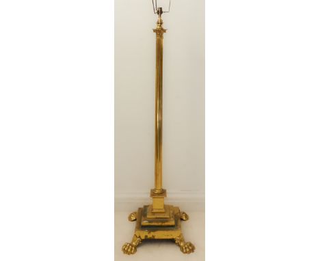 A heavy brass lamp standard modelled as a corinthian column with acanthus capitals, reeded stem and stepped square base with 