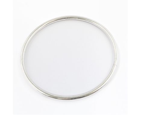 A heavy circular silver bangle (7cm diameter) (boxed)