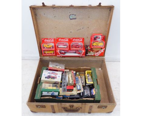 Thirty-four boxed die-cast vehicles contained in a vintage suitcase:2 x Hot Wheels;2 x Matchbox (K10 and K11);5 x Dinky;6 x C