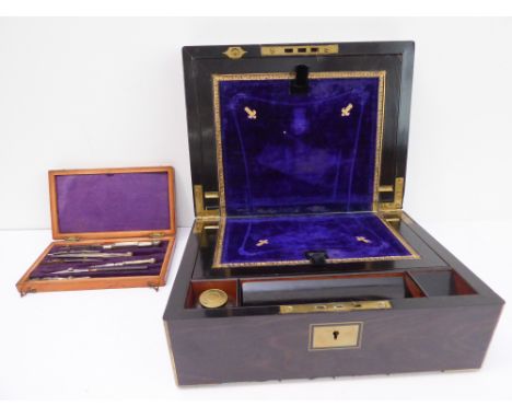 A mid-19th century brass-bound&nbsp;calamander writing slope: hinged top opening to reveal gilt-tooled velvet interior writin