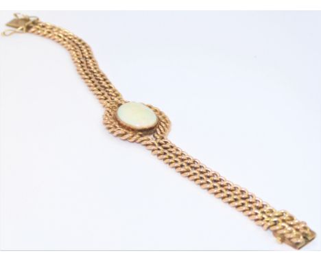 A 9-carat rose gold double link chain bracelet centrally set with an oval opal: the chain links stamped '375' (19cm, total we