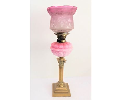 A 19th century brass and opaline glass oil lamp: the shade etched with flowers and further flowers emanating from vases above