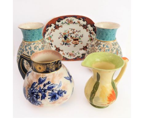 Five ceramics items:a pair of Crown Albion ceramic vases decorated and gilded with flowers against a textured ground, printed