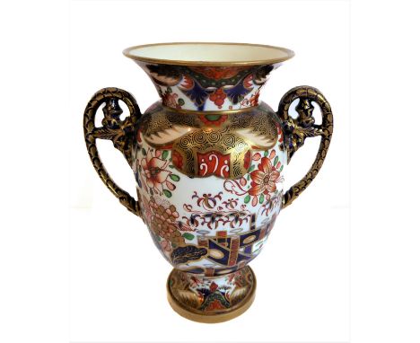 An early 19th century two-handled Spode porcelain vase: hand gilded and decorated in the Imari palette, red-painted Spode mar