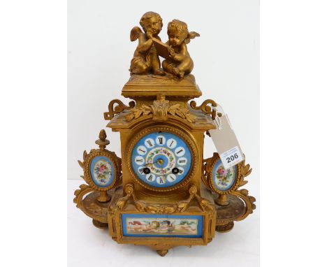 A 19th century gilt-metal and porcelain mounted eight-day French mantle clock: two-winged cherub figures surmounting; celeste