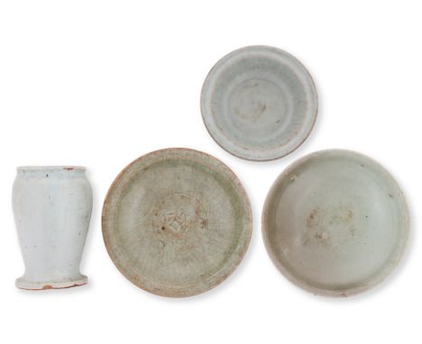 A GROUP OF FOUR CELADON WARES
12th century and later, small bowl with grey-green glaze, fluted inner walls and overhanging ri