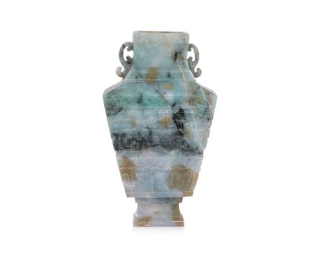 A CARVED JADE TWIN HANDLED VASE
20th century, tapering rectangular section carved in shallow relief with archaic scrolls abov