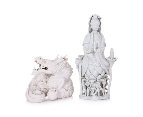 TWO BLANC DE CHINE PORCELAIN ITEMS
19th/20th century, a figure of Guanyin, seated on a lotus plinth, repairs; and a figure of