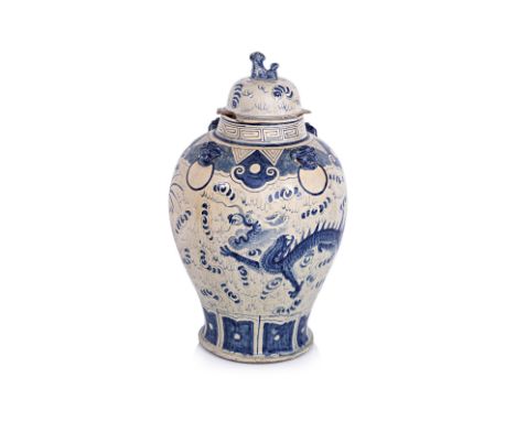 A VERY LARGE VIETNAMESE BLUE AND WHITE DRAGON VASE
18th/19th century, baluster form stoneware decorated in two flying dragons